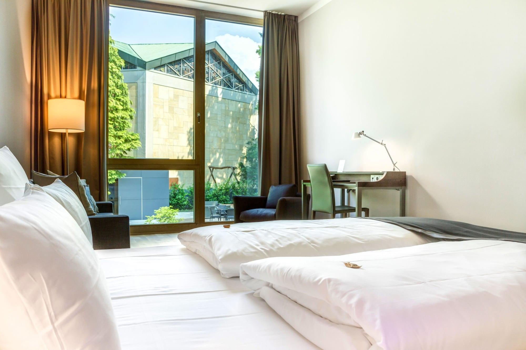 Qube Hotel Bergheim Heidelberg Bagian luar foto